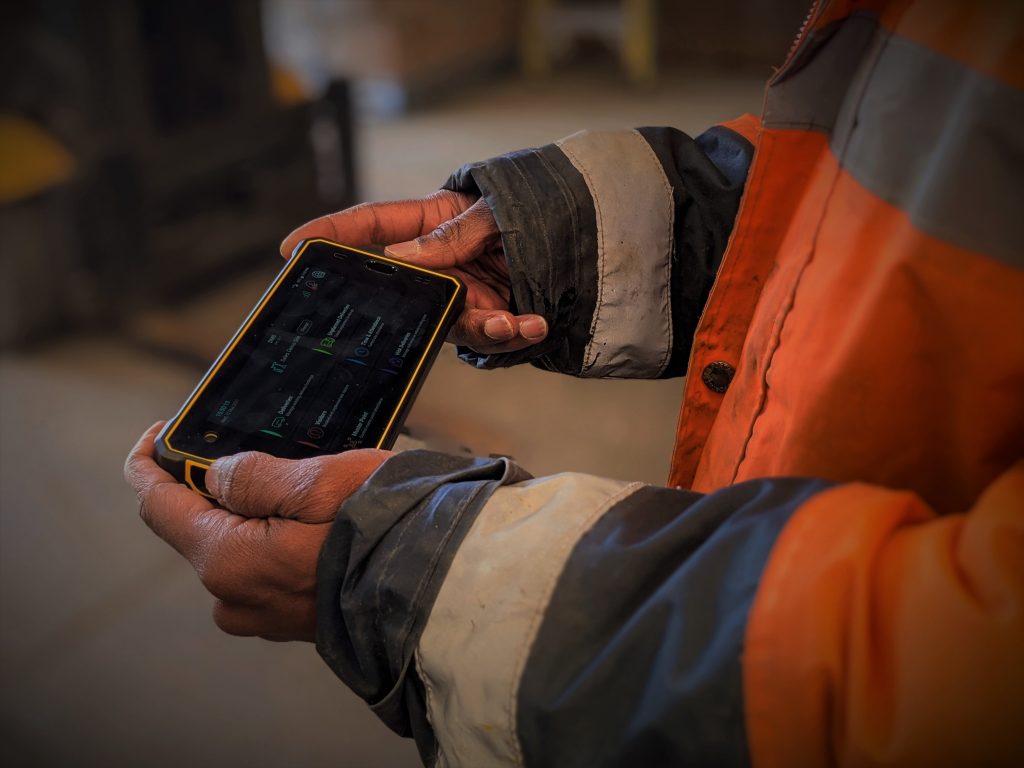 Worker looking at phone app