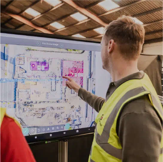 Worker pointing at screen